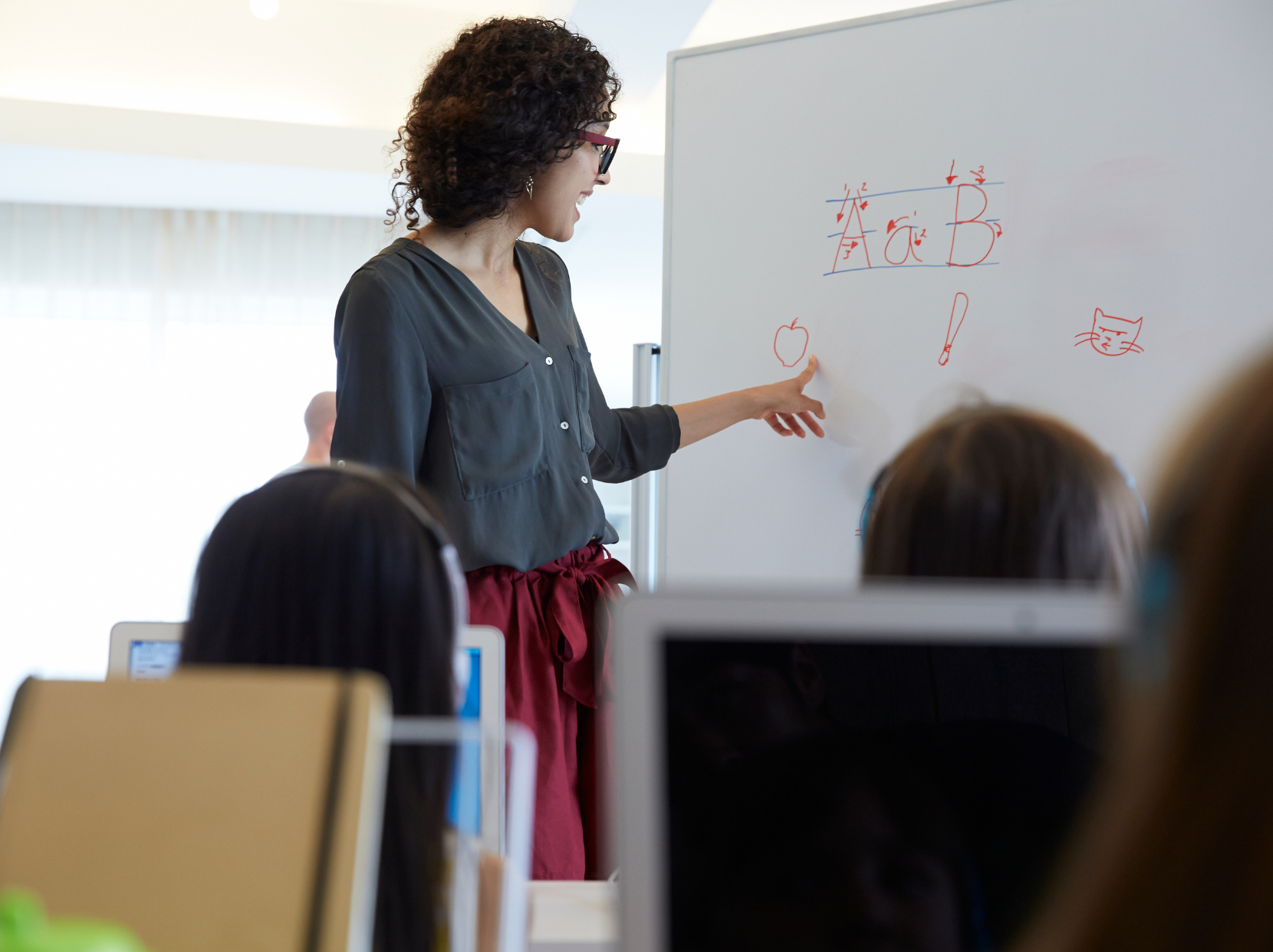 A teacher guiding students through a classroom activity