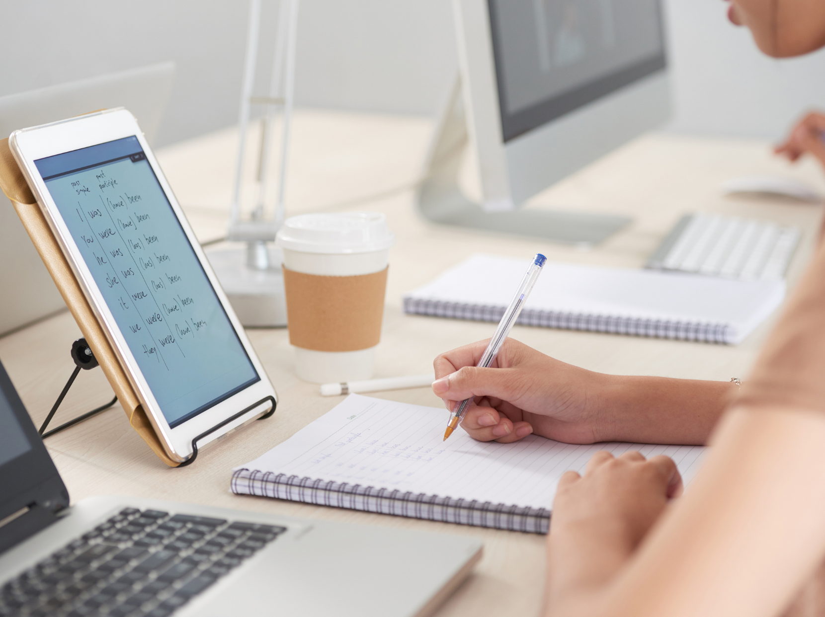 A student taking part in an online English lesson